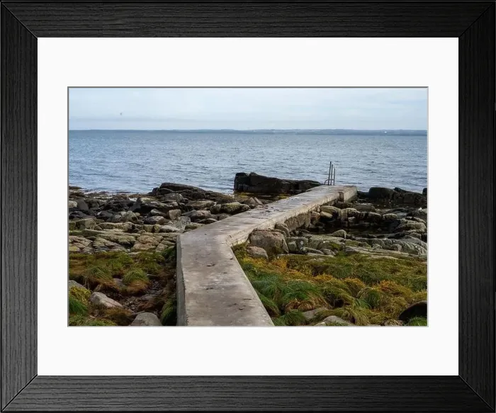 Framed Print : Rocky shoreline with a concrete jetty Framed Print : Rocky shoreline with a concrete jetty