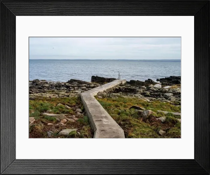 Framed Print : Rocky shoreline with a concrete jetty Framed Print : Rocky shoreline with a concrete jetty