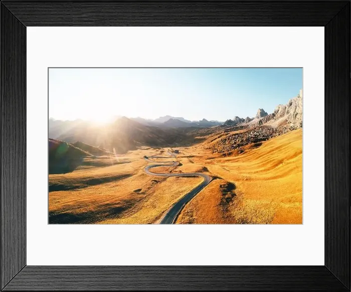 Framed Print : Incredible aerial view on winding road in autumn mountain valley at sunset Framed Print : Incredible aerial view on winding road in autumn mountain valley at sunset