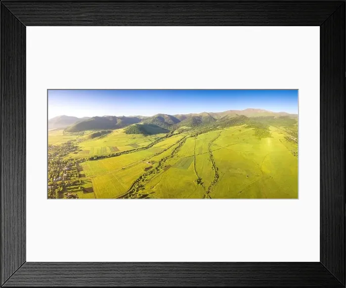 Framed Print : Panoramic aerial view of lush green fields and village houses Framed Print : Panoramic aerial view of lush green fields and village houses