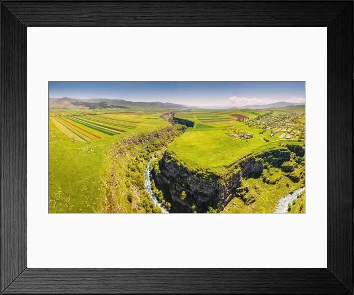 Framed Print : Panoramic aerial view of agricultural fields sown with crops and river in deep canyon Framed Print : Panoramic aerial view of agricultural fields sown with crops and river in deep canyon