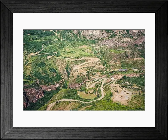 Framed Print : View from the cab of the cable car on the mountain serpentines leading to the Tatev Monastery in Armenia Framed Print : View from the cab of the cable car on the mountain serpentines leading to the Tatev Monastery in Armenia
