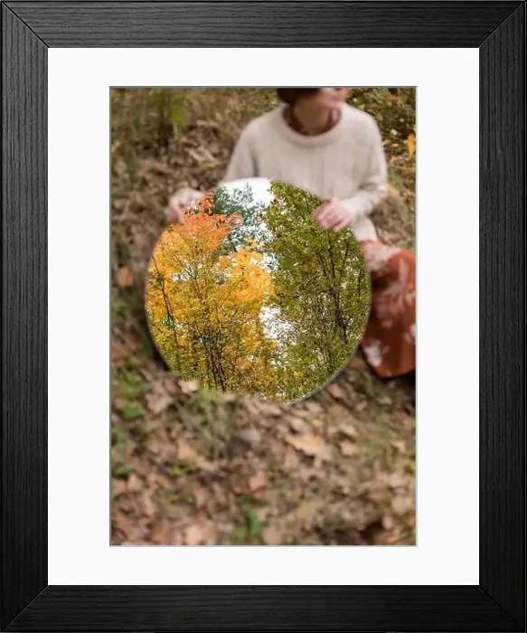 Framed Print : Woman holding mirror with autumn trees reflection Framed Print : Woman holding mirror with autumn trees reflection