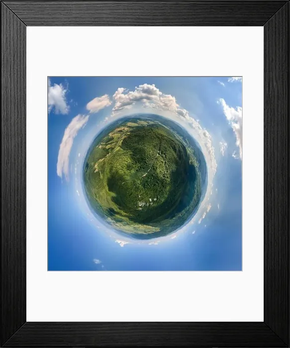 Framed Print : Little planet globe with dark mountain hills covered with green mixed pine
