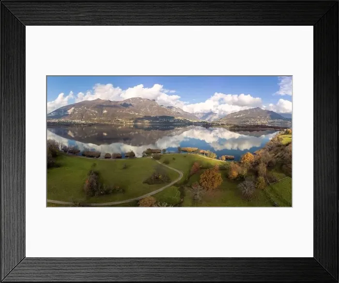 Framed Print : Aerial view of an alpine lake and the surrounding mountains and vegetations reflected on a cloudy day Framed Print : Aerial view of an alpine lake and the surrounding mountains and vegetations reflected on a cloudy day