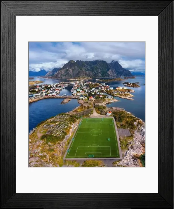 Framed Print : Aerial view of football field or soccer field in the Henningsvaer with mountains in the background Framed Print : Aerial view of football field or soccer field in the Henningsvaer with mountains in the background