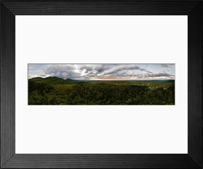 Framed Print : Aerial wide panoramic view of dark mountain hills covered with green mixed pine and lush forest in evening Framed Print : Aerial wide panoramic view of dark mountain hills covered with green mixed pine and lush forest in evening