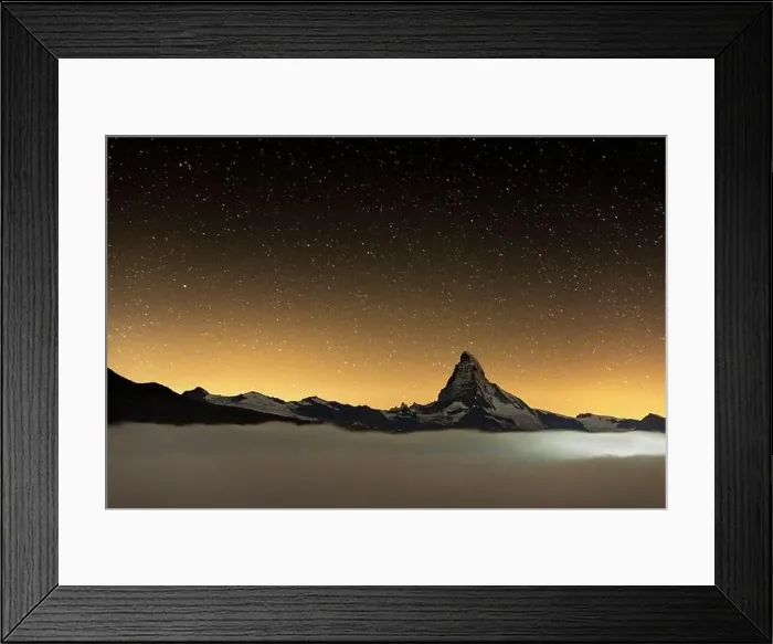 Framed Print : Romantic night sky with stars over Matterhorn emerging from fog, Zermatt, Valais canton, Switzerland Framed Print : Romantic night sky with stars over Matterhorn emerging from fog, Zermatt, Valais canton, Switzerland