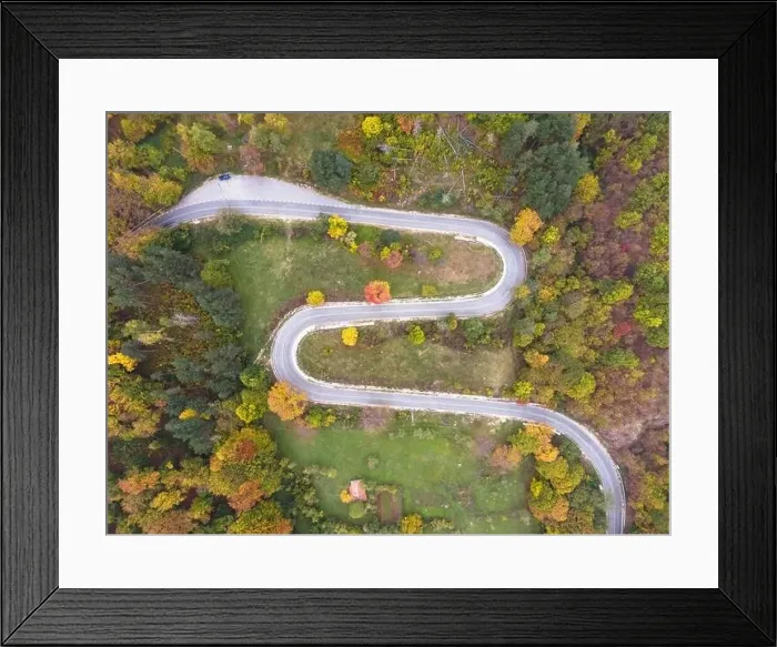 Framed Print : Stunning aerial view of road with curves crossing dense forest in autumn colors in Bulgaria. High quality photo Framed Print : Stunning aerial view of road with curves crossing dense forest in autumn colors in Bulgaria. High quality photo