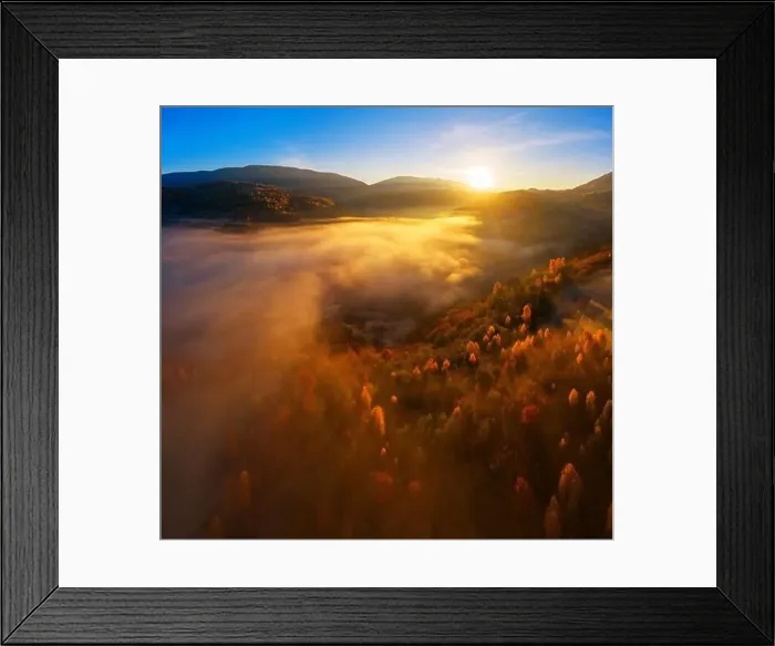 Framed Print : Wonderful autumn landscape in the mountains at dawn. Drone view of the autumn forest and low clouds Framed Print : Wonderful autumn landscape in the mountains at dawn. Drone view of the autumn forest and low clouds