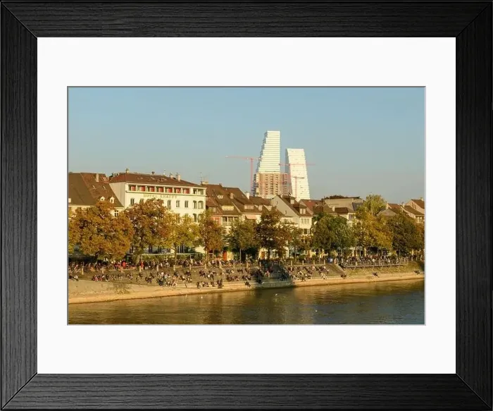 Framed Print : Basel, Switzerland - 17 Oktober 2021: people relaxing by the river Rhine at Basel in Switzerland Framed Print : Basel, Switzerland - 17 Oktober 2021: people relaxing by the river Rhine at Basel in Switzerland