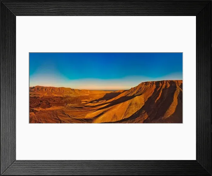 Framed Print : Dramatic panoramic image of the volcanic mountain landscape of Fuerteventura Framed Print : Dramatic panoramic image of the volcanic mountain landscape of Fuerteventura