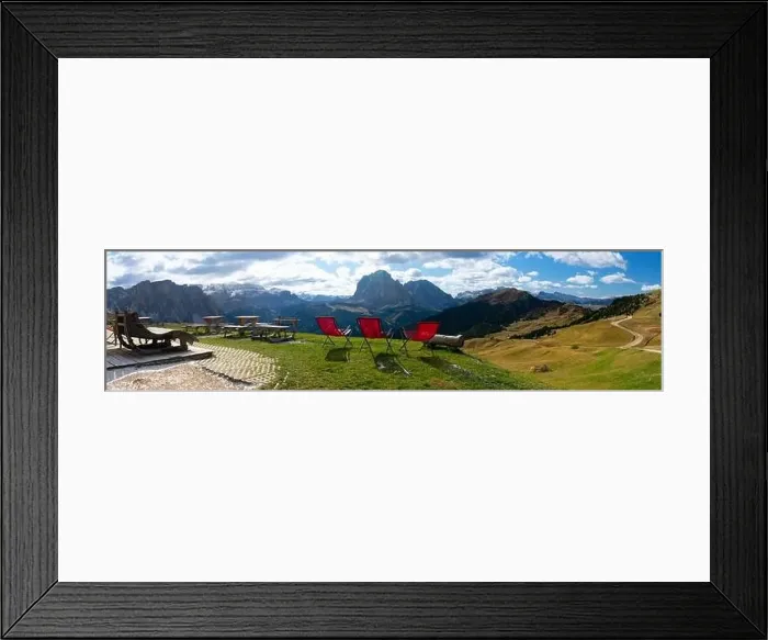 Framed Print : Red lawn chairs with dramtic Mountain background. Dolomites in European Alps. Gardena Pass, Italy. Vacation Theme Framed Print : Red lawn chairs with dramtic Mountain background. Dolomites in European Alps. Gardena Pass, Italy. Vacation Theme