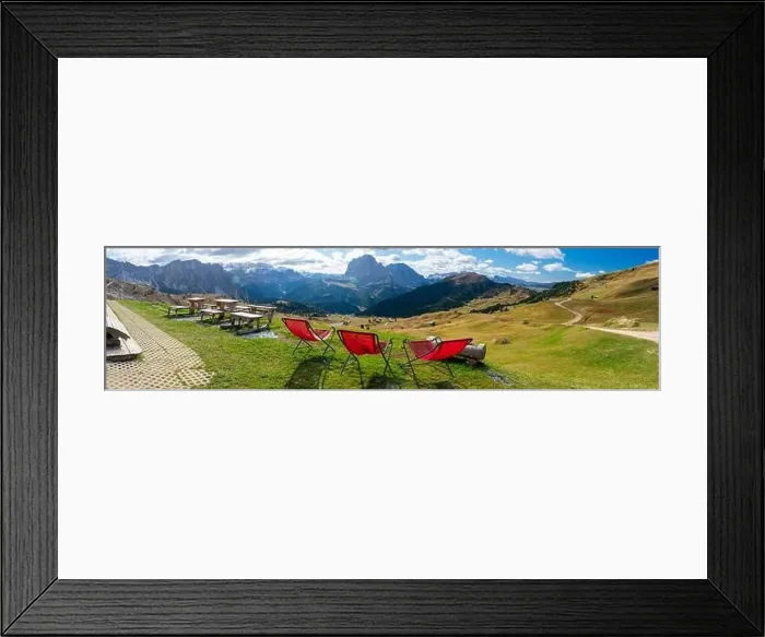 Framed Print : Red lawn chairs with dramtic Mountain background. Dolomites in European Alps. Gardena Pass, Italy. Vacation Theme Framed Print : Red lawn chairs with dramtic Mountain background. Dolomites in European Alps. Gardena Pass, Italy. Vacation Theme