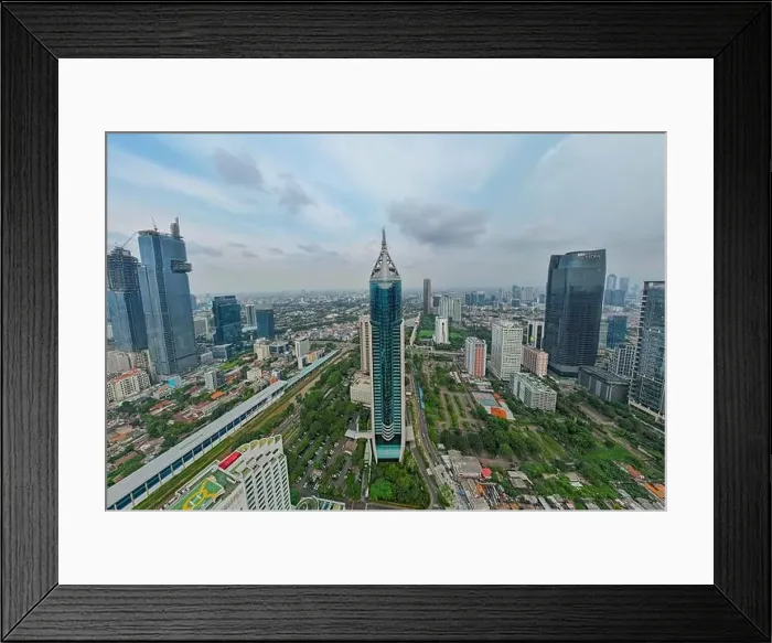 Framed Print : Aerial view of BNI 46 building in Jakarta and noise cloud with cityscape Framed Print : Aerial view of BNI 46 building in Jakarta and noise cloud with cityscape
