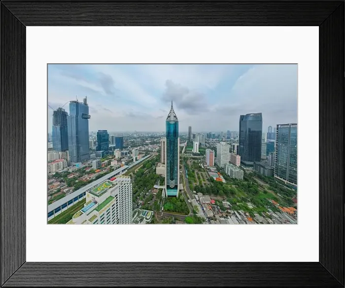 Framed Print : Aerial view of BNI 46 building in Jakarta and noise cloud with cityscape Framed Print : Aerial view of BNI 46 building in Jakarta and noise cloud with cityscape
