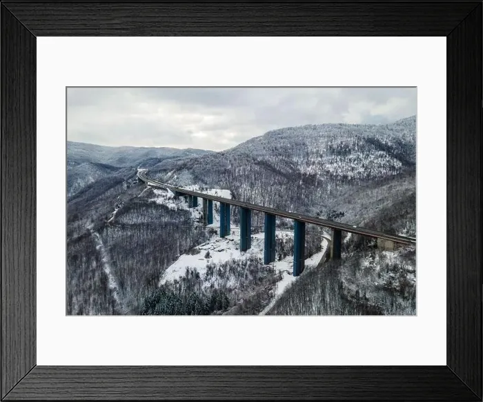 Framed Print : Amazing aerial view of a road. Stunning snow landscape with river and trees Framed Print : Amazing aerial view of a road. Stunning snow landscape with river and trees