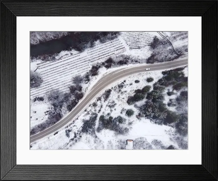 Framed Print : High angle top down aerial view drone image on road trough the trees Framed Print : High angle top down aerial view drone image on road trough the trees