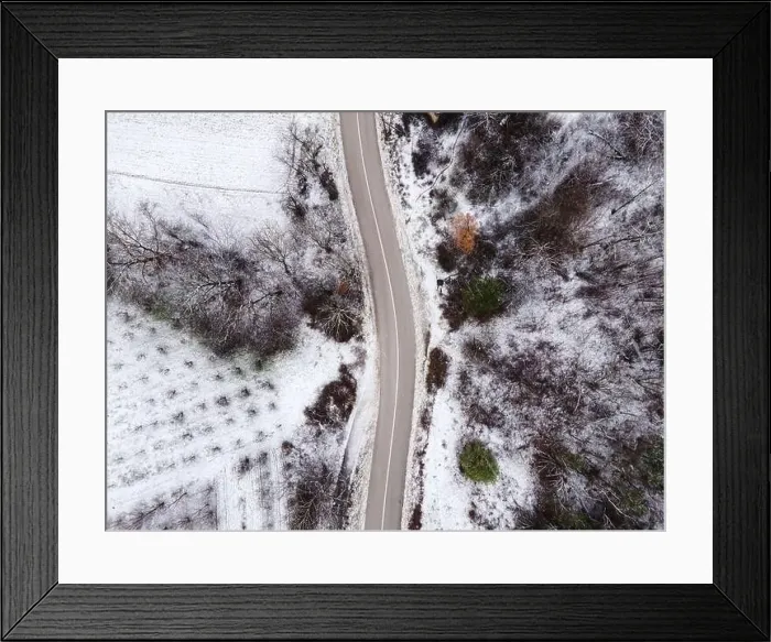 Framed Print : High angle top down aerial view drone image on road trough the trees