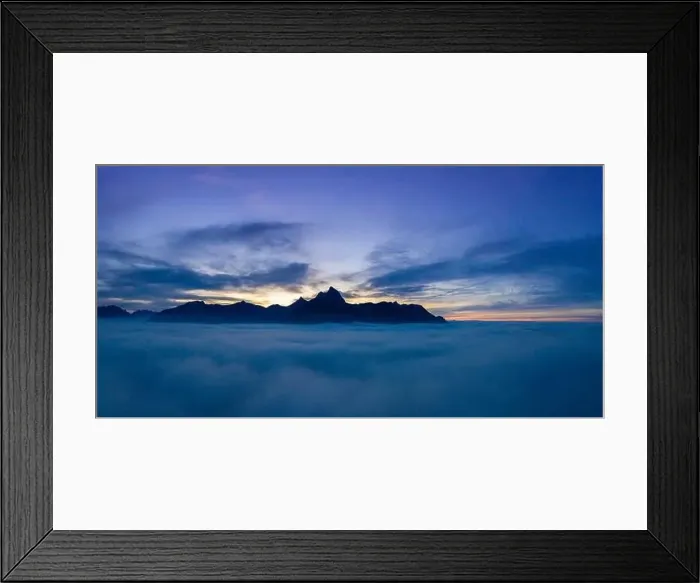 Framed Print : cloudy sunset panorama over clouds with view to mountain chain hahenkamm at reutte