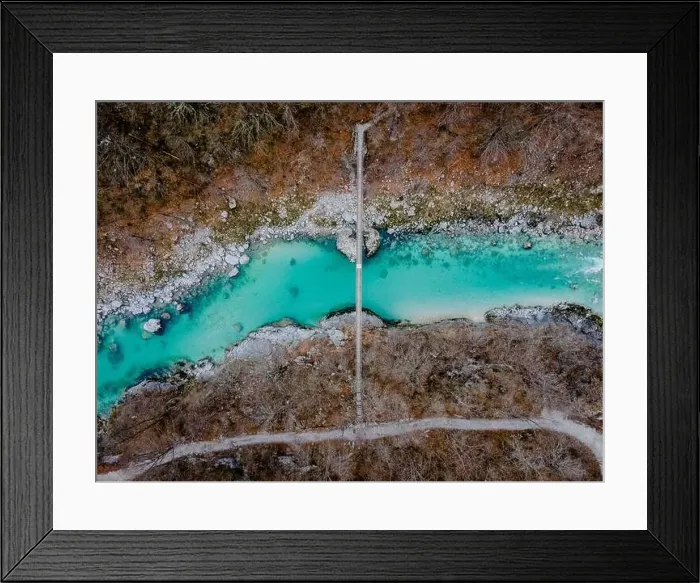 Framed Print : Aerial drone shot of bridge over the beautiful crystal blue Soca River at the Kozjak fall in Slovenia, Europe Framed Print : Aerial drone shot of bridge over the beautiful crystal blue Soca River at the Kozjak fall in Slovenia, Europe