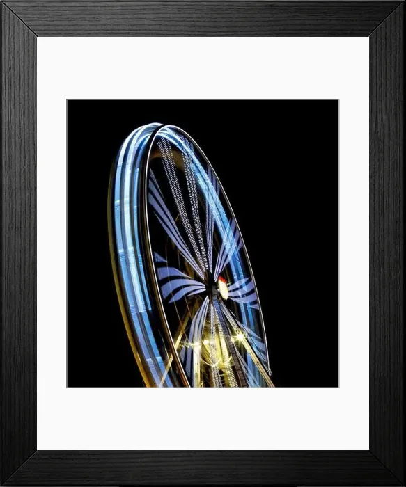 Framed Print : Defocused Ferris Wheel at amusement park at night. Blur abstract spinning wheel background Framed Print : Defocused Ferris Wheel at amusement park at night. Blur abstract spinning wheel background