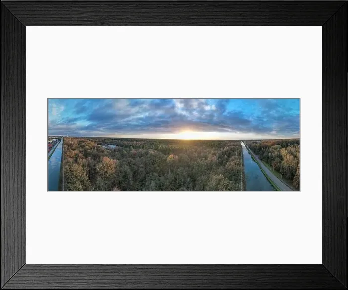 Framed Print : beautiful aerial panorama of a sunset over a river with green bushes and color rich sky Framed Print : beautiful aerial panorama of a sunset over a river with green bushes and color rich sky