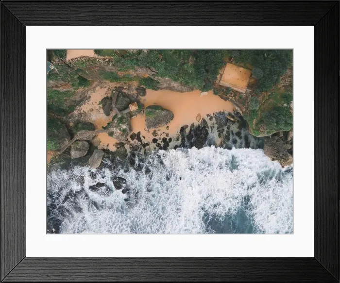 Framed Print : Top down aerial view of giant ocean waves crashing and foaming in coral beach Framed Print : Top down aerial view of giant ocean waves crashing and foaming in coral beach