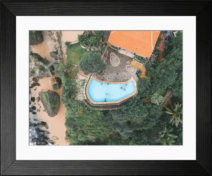Framed Print : Top aerial view of swimming pool in villa near beach