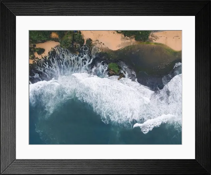 Framed Print : Top down aerial view of giant ocean waves crashing and foaming in coral beach Framed Print : Top down aerial view of giant ocean waves crashing and foaming in coral beach