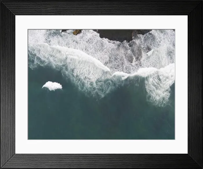 Framed Print : Top down aerial view of giant ocean waves crashing and foaming in coral beach Framed Print : Top down aerial view of giant ocean waves crashing and foaming in coral beach