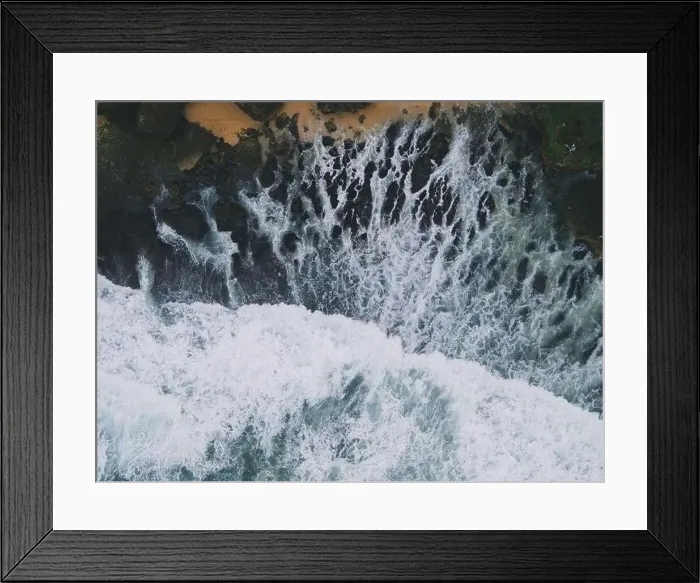 Framed Print : Top down aerial view of giant ocean waves crashing and foaming in coral beach Framed Print : Top down aerial view of giant ocean waves crashing and foaming in coral beach