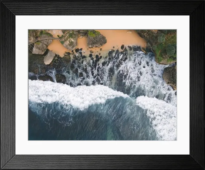 Framed Print : Top down aerial view of giant ocean waves crashing and foaming in coral beach Framed Print : Top down aerial view of giant ocean waves crashing and foaming in coral beach