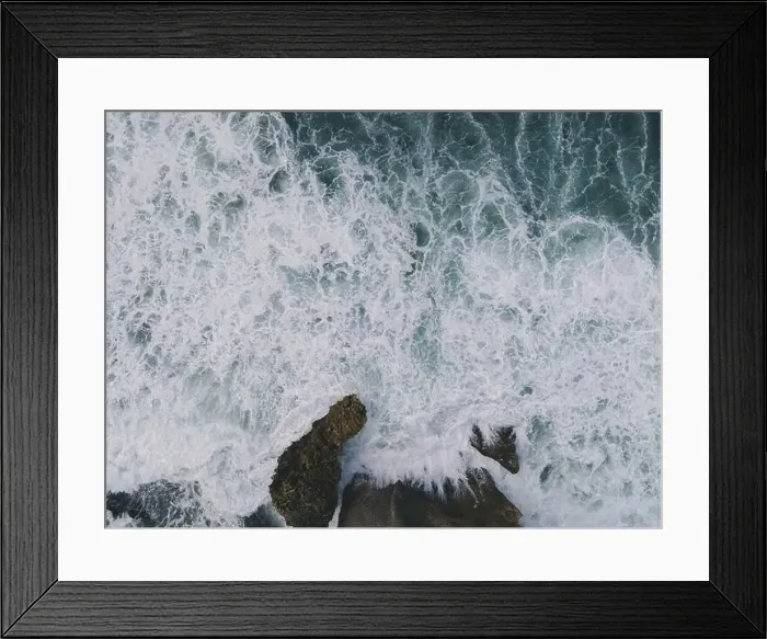 Framed Print : Top down aerial view of giant ocean waves crashing and foaming in coral beach Framed Print : Top down aerial view of giant ocean waves crashing and foaming in coral beach