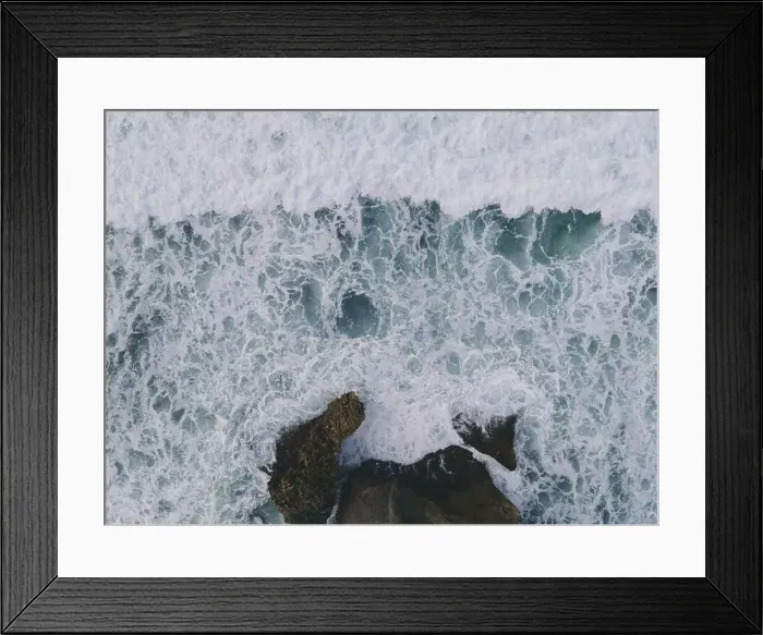 Framed Print : Top down aerial view of giant ocean waves crashing and foaming in coral beach Framed Print : Top down aerial view of giant ocean waves crashing and foaming in coral beach