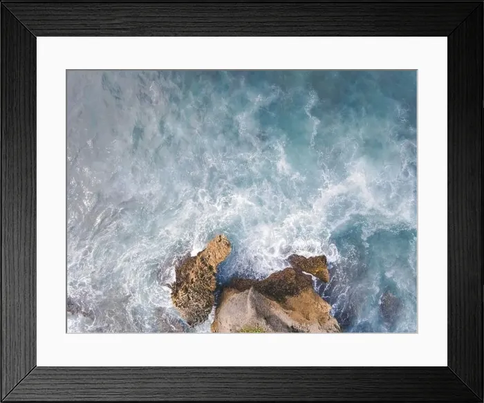 Framed Print : Top down aerial view of giant ocean waves crashing and foaming in coral beach Framed Print : Top down aerial view of giant ocean waves crashing and foaming in coral beach