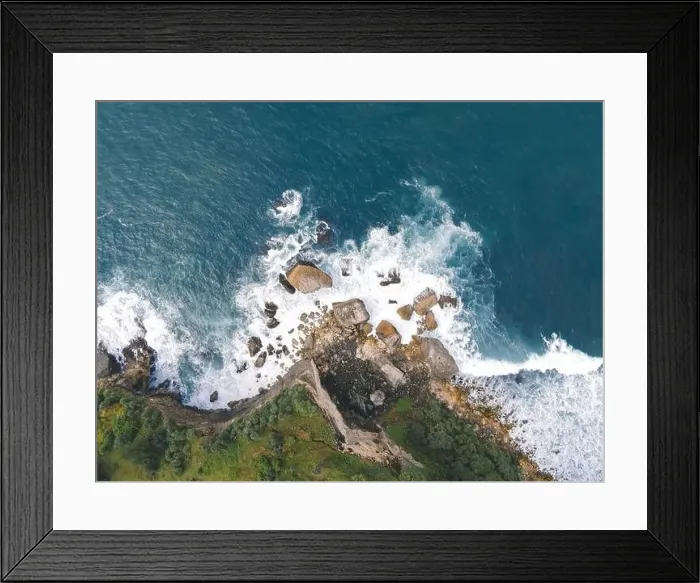 Framed Print : Top down aerial view of giant ocean waves crashing and foaming in coral beach Framed Print : Top down aerial view of giant ocean waves crashing and foaming in coral beach