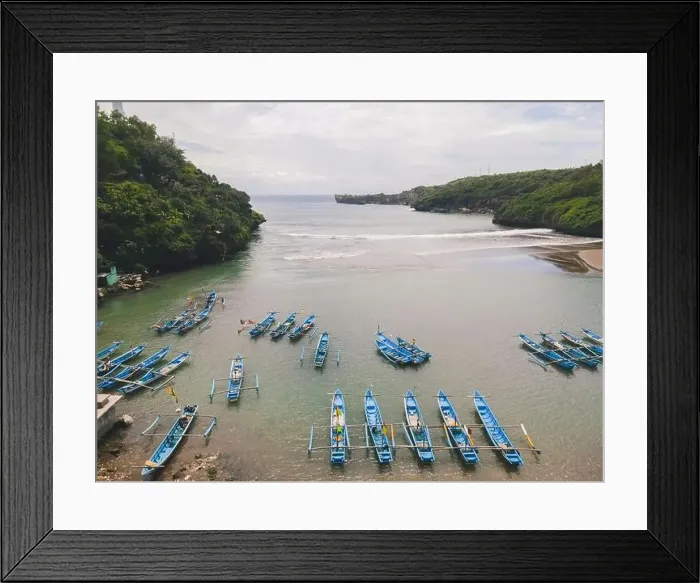 Framed Print : Aerial view of Baron beach in Yogyakarta, Indonesia with lighthouse and traditional boats Framed Print : Aerial view of Baron beach in Yogyakarta, Indonesia with lighthouse and traditional boats