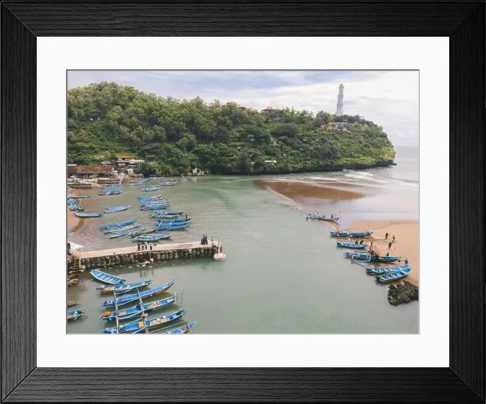 Framed Print : Aerial view of Baron beach in Yogyakarta, Indonesia with lighthouse and traditional boats Framed Print : Aerial view of Baron beach in Yogyakarta, Indonesia with lighthouse and traditional boats