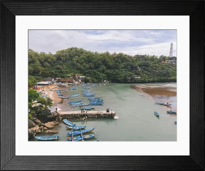 Framed Print : Aerial view of Baron beach in Yogyakarta, Indonesia with lighthouse and traditional boats Framed Print : Aerial view of Baron beach in Yogyakarta, Indonesia with lighthouse and traditional boats