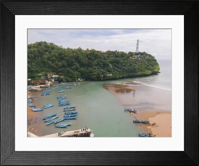 Framed Print : Aerial view of Baron beach in Yogyakarta, Indonesia with lighthouse and traditional boats Framed Print : Aerial view of Baron beach in Yogyakarta, Indonesia with lighthouse and traditional boats