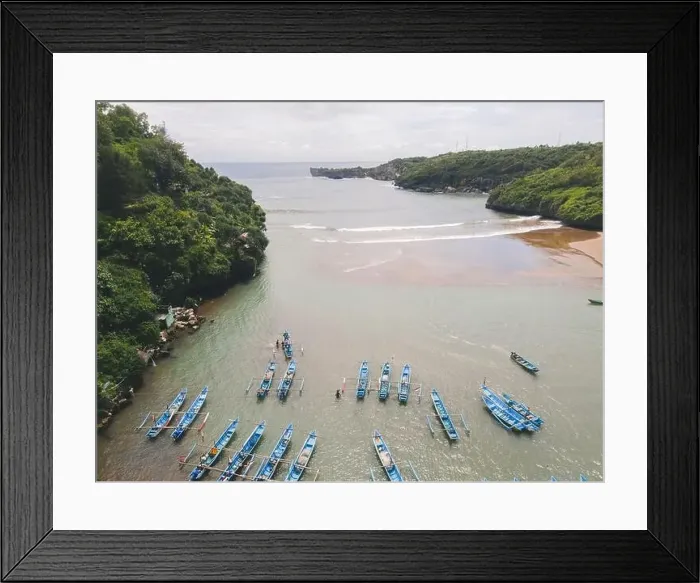 Framed Print : Aerial view of Baron beach in Yogyakarta, Indonesia with lighthouse and traditional boats Framed Print : Aerial view of Baron beach in Yogyakarta, Indonesia with lighthouse and traditional boats