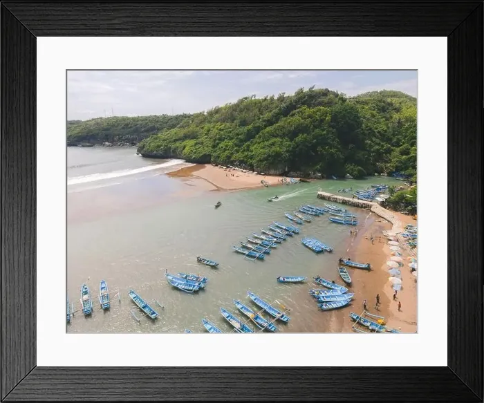 Framed Print : Aerial view of Baron beach in Yogyakarta, Indonesia with lighthouse and traditional boats Framed Print : Aerial view of Baron beach in Yogyakarta, Indonesia with lighthouse and traditional boats
