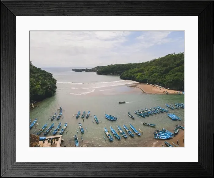 Framed Print : Aerial view of Baron beach in Yogyakarta, Indonesia with lighthouse and traditional boats Framed Print : Aerial view of Baron beach in Yogyakarta, Indonesia with lighthouse and traditional boats