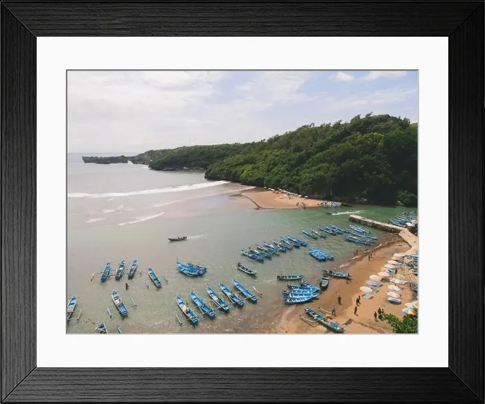 Framed Print : Aerial view of Baron beach in Yogyakarta, Indonesia with lighthouse and traditional boats Framed Print : Aerial view of Baron beach in Yogyakarta, Indonesia with lighthouse and traditional boats