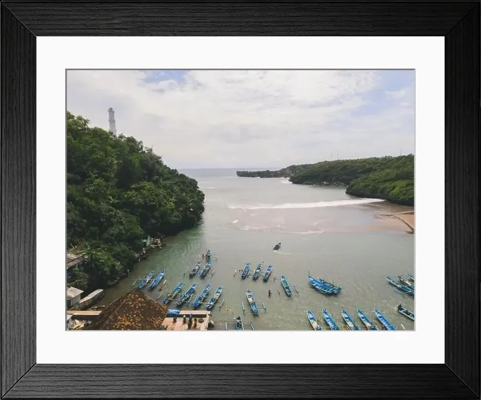 Framed Print : Aerial view of Baron beach in Yogyakarta, Indonesia with lighthouse and traditional boats Framed Print : Aerial view of Baron beach in Yogyakarta, Indonesia with lighthouse and traditional boats