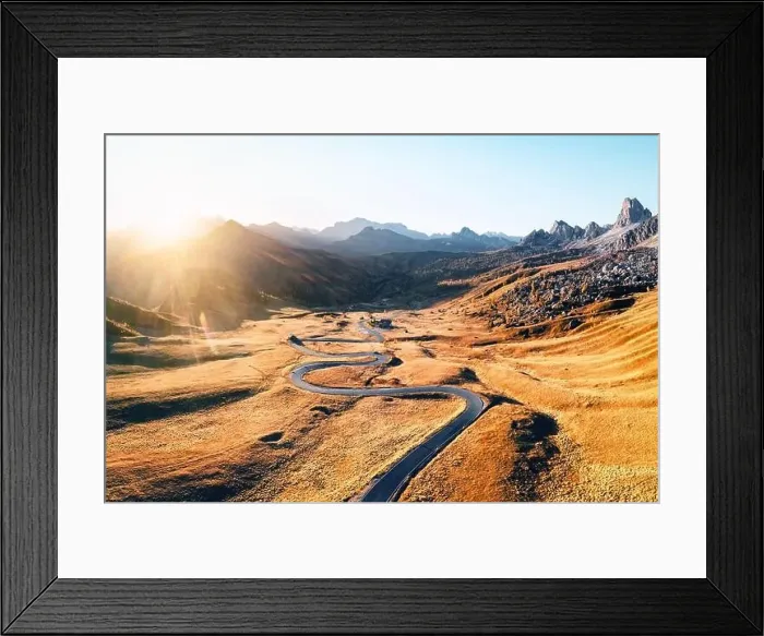 Framed Print : Fantastic aerial view on winding road in autumn mountain valley at sunset Framed Print : Fantastic aerial view on winding road in autumn mountain valley at sunset