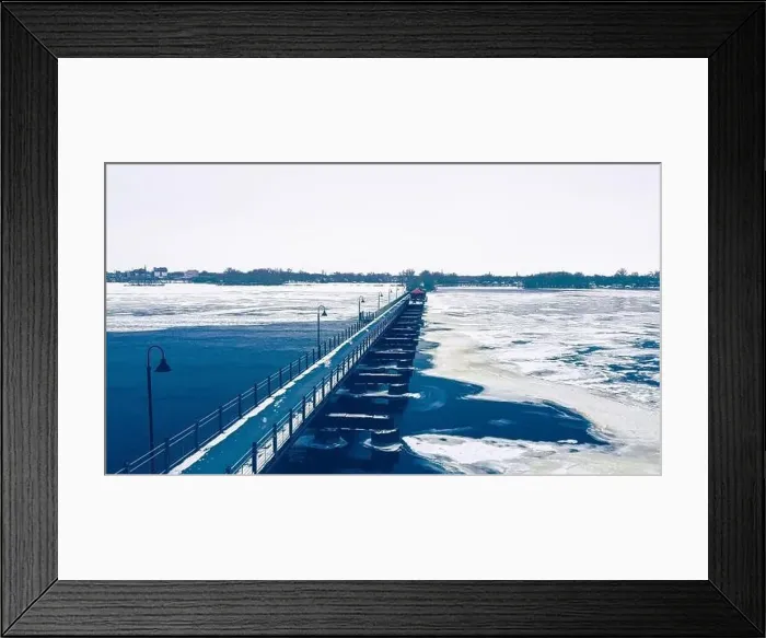 Framed Print : The frozen landscape with hiking / walking trail bridge over the frozen water Framed Print : The frozen landscape with hiking / walking trail bridge over the frozen water