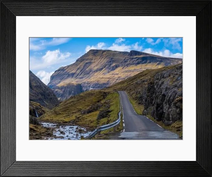 Framed Print : A scenic empty straight uphill road leading to Saksun, in Faroe Islands Framed Print : A scenic empty straight uphill road leading to Saksun, in Faroe Islands