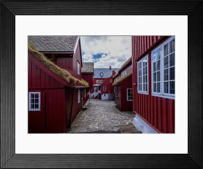 Framed Print : This village with its red houses, white windows, grass rooves and cobbled streets could be straight out of a fairytale Framed Print : This village with its red houses, white windows, grass rooves and cobbled streets could be straight out of a fairytale
